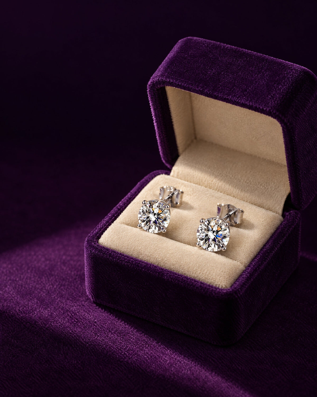 Round solitaire studs, sterling silver, in a velvet box