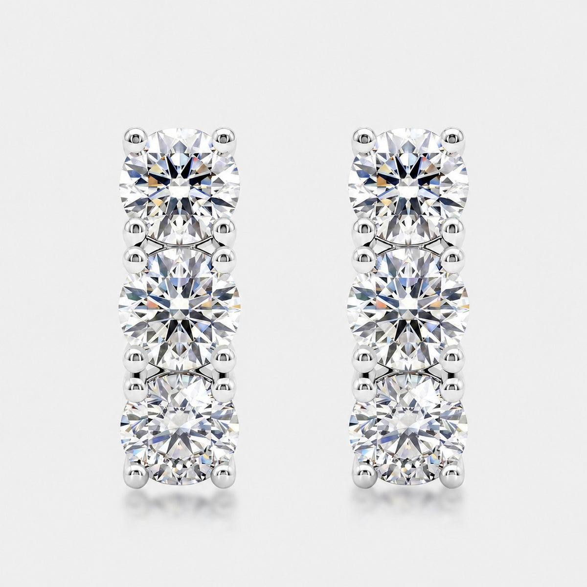 Three-stone line studs, sterling silver