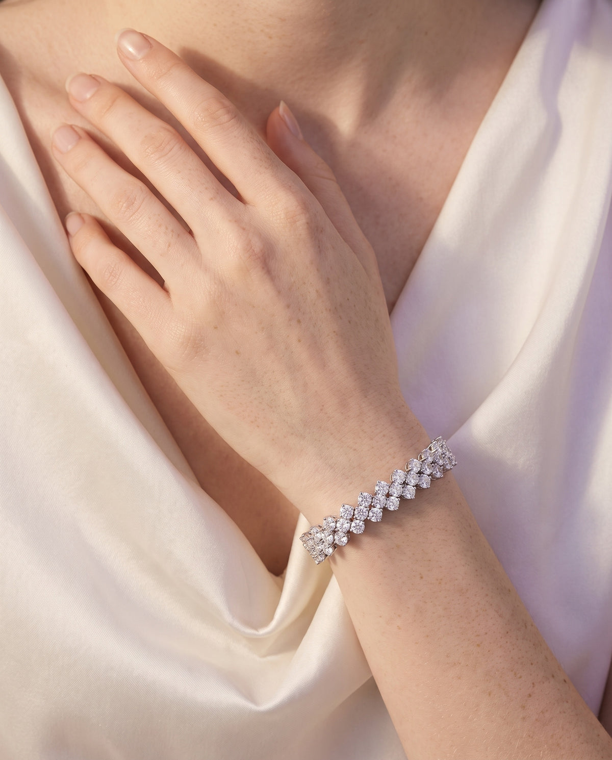 Three-heart bracelet, sterling silver, worn on the wrist